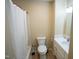 A well-lit bathroom has a shower-tub and a single sink vanity at 410 N Currie Dr, Sanford, NC 27330