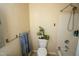 Neutral bathroom featuring white bathtub and toilet, complete with plant on the tank at 410 N Currie Dr, Sanford, NC 27330