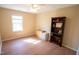 Bedroom with wood-look flooring, storage and light walls at 410 N Currie Dr, Sanford, NC 27330