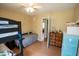 Bedroom with a bunkbed, dresser, and door to adjoining rooms at 410 N Currie Dr, Sanford, NC 27330