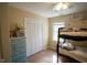This bedroom includes a bunk bed, built-in closet, and natural light at 410 N Currie Dr, Sanford, NC 27330