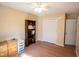 Bedroom featuring wood-look floors, a ceiling fan and light walls at 410 N Currie Dr, Sanford, NC 27330
