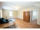 Spacious bonus room with wood-look floors, ceiling fan and view to hallway at 410 N Currie Dr, Sanford, NC 27330