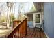 Back deck with wood railing and seating at 410 N Currie Dr, Sanford, NC 27330