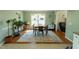 Bright dining room features hardwood floors, a chandelier, and a large window with natural light at 410 N Currie Dr, Sanford, NC 27330