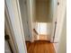 Hallway with hardwood floors leading to various rooms at 410 N Currie Dr, Sanford, NC 27330