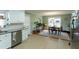 Eat-in kitchen area with stainless steel appliances and a view of the backyard at 410 N Currie Dr, Sanford, NC 27330