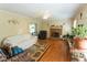 Comfortable living room with brick fireplace, ceiling fan and plenty of natural light at 410 N Currie Dr, Sanford, NC 27330