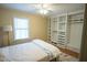 Bright main bedroom with large window, ceiling fan and built in closet at 410 N Currie Dr, Sanford, NC 27330