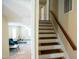 Staircase connecting multiple levels and leading to a sunlit living area at 410 N Currie Dr, Sanford, NC 27330