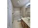 Bathroom features tiled floors, bath-shower combination, and a wood vanity at 4116 Tall Pine Dr, Franklinton, NC 27525