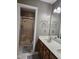Bathroom featuring a double sink vanity and large shower with a built-in seat at 4116 Tall Pine Dr, Franklinton, NC 27525