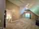 Spacious upstairs bedroom featuring carpet floors, a ceiling fan, and an attic door at 4116 Tall Pine Dr, Franklinton, NC 27525