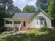Charming single-story home with a covered front porch and well-manicured landscaping at 4116 Tall Pine Dr, Franklinton, NC 27525