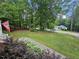 View from the porch showing the spacious yard, mature trees, and serene neighborhood atmosphere at 4116 Tall Pine Dr, Franklinton, NC 27525