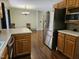 Functional kitchen with stainless steel appliances and ample counter space, seamlessly flowing into the living area at 4116 Tall Pine Dr, Franklinton, NC 27525