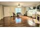 Bright living room features a fireplace, hardwood floors, and a large window at 4116 Tall Pine Dr, Franklinton, NC 27525