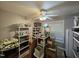 Pantry or storage room with shelving, a ceiling fan, and a window at 4116 Tall Pine Dr, Franklinton, NC 27525