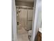 Bathroom features a shower with glass doors, tiled floors, and a seat at 4116 Tall Pine Dr, Franklinton, NC 27525