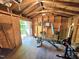 Inside a workout shed, with open framing and standard workbench including various pieces of workout equipment at 4116 Tall Pine Dr, Franklinton, NC 27525