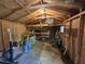 Inside workout shed, with open framing and standard workbench including weights and workout equipment at 4116 Tall Pine Dr, Franklinton, NC 27525
