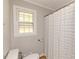 Bathroom with a patterned shower curtain and functional fixtures at 412 Winterlocken Dr, Sanford, NC 27330
