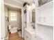 Cozy bathroom featuring white cabinets, modern fixtures, and ample storage at 412 Winterlocken Dr, Sanford, NC 27330