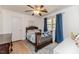 Bedroom with hardwood floors, ceiling fan, and a cozy bed at 412 Winterlocken Dr, Sanford, NC 27330