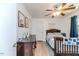 Bright bedroom with hardwood floors, fan, and comfortable bed at 412 Winterlocken Dr, Sanford, NC 27330