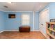 Bedroom featuring light blue walls, hardwood floors, and natural light at 412 Winterlocken Dr, Sanford, NC 27330