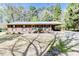 Charming single-story home with a well-manicured front yard and mature trees at 412 Winterlocken Dr, Sanford, NC 27330