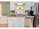 Well-lit kitchen with stainless steel appliances and white cabinetry at 412 Winterlocken Dr, Sanford, NC 27330