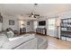 Bright living room with hardwood floors, ceiling fan, and large windows at 412 Winterlocken Dr, Sanford, NC 27330