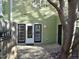 Back entrance view featuring double doors and access to the storage shed, perfect for convenience at 4425 Moss Garden Path, Raleigh, NC 27616