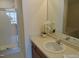 Bathroom featuring a walk-in shower, sink, and updated fixtures at 4425 Moss Garden Path, Raleigh, NC 27616