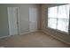 Bedroom featuring neutral carpeting and two closets at 4425 Moss Garden Path, Raleigh, NC 27616