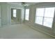 Bright bedroom featuring neutral tones, carpet, ceiling fan, and mirrored closet at 4425 Moss Garden Path, Raleigh, NC 27616