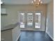 Dining area features tiled floors and backyard access at 4425 Moss Garden Path, Raleigh, NC 27616