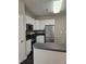 Well-equipped kitchen featuring stainless steel appliances and white cabinetry at 4425 Moss Garden Path, Raleigh, NC 27616