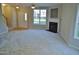 Inviting living room with a fireplace, large windows, and an open layout near the staircase at 4425 Moss Garden Path, Raleigh, NC 27616