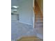 Carpeted staircase in neutral colors leading to the next level at 4425 Moss Garden Path, Raleigh, NC 27616