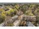 A neighborhood's aerial view, filled with verdant trees in a desirable location at 4447 Antique Ln, Raleigh, NC 27616