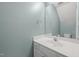 Bright powder room with white vanity and modern fixtures at 4447 Antique Ln, Raleigh, NC 27616