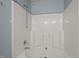 A modern bathtub with a shower head, offering a relaxing and convenient bathing experience at 4447 Antique Ln, Raleigh, NC 27616