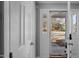 Welcoming entryway with glass-paneled front door and natural light at 4447 Antique Ln, Raleigh, NC 27616