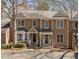 Charming two-story townhome with well-maintained landscaping and classic architectural details at 4447 Antique Ln, Raleigh, NC 27616