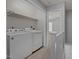 Upstairs laundry area with modern washer and dryer for convenient and efficient laundry at 4447 Antique Ln, Raleigh, NC 27616
