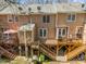 Back of townhomes with decks, outdoor areas for leisure, and multiple levels of comfortable living at 4447 Antique Ln, Raleigh, NC 27616
