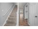 Carpeted staircase leading to upper level, connecting the main rooms at 4447 Antique Ln, Raleigh, NC 27616