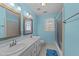 Bathroom with dual sinks and bathtub/shower at 5122 Berkeley St, Raleigh, NC 27612